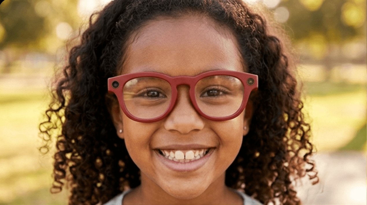 Girl smiling while wearing Shiro glasses